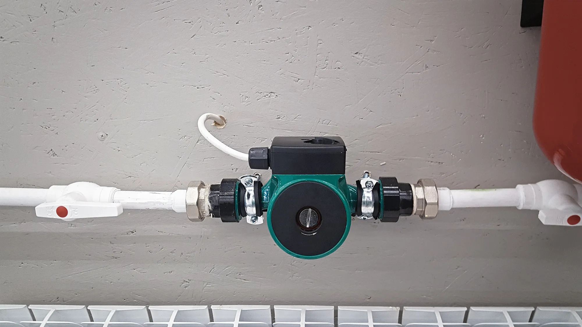 Water heater recirculating pumps